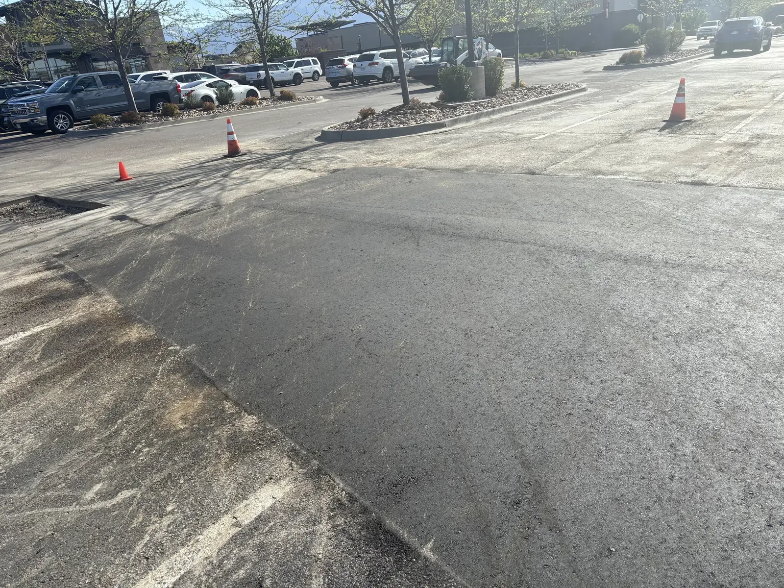 Milled and repaved section of a busy commercial parking lot — near Elizabeth, CO