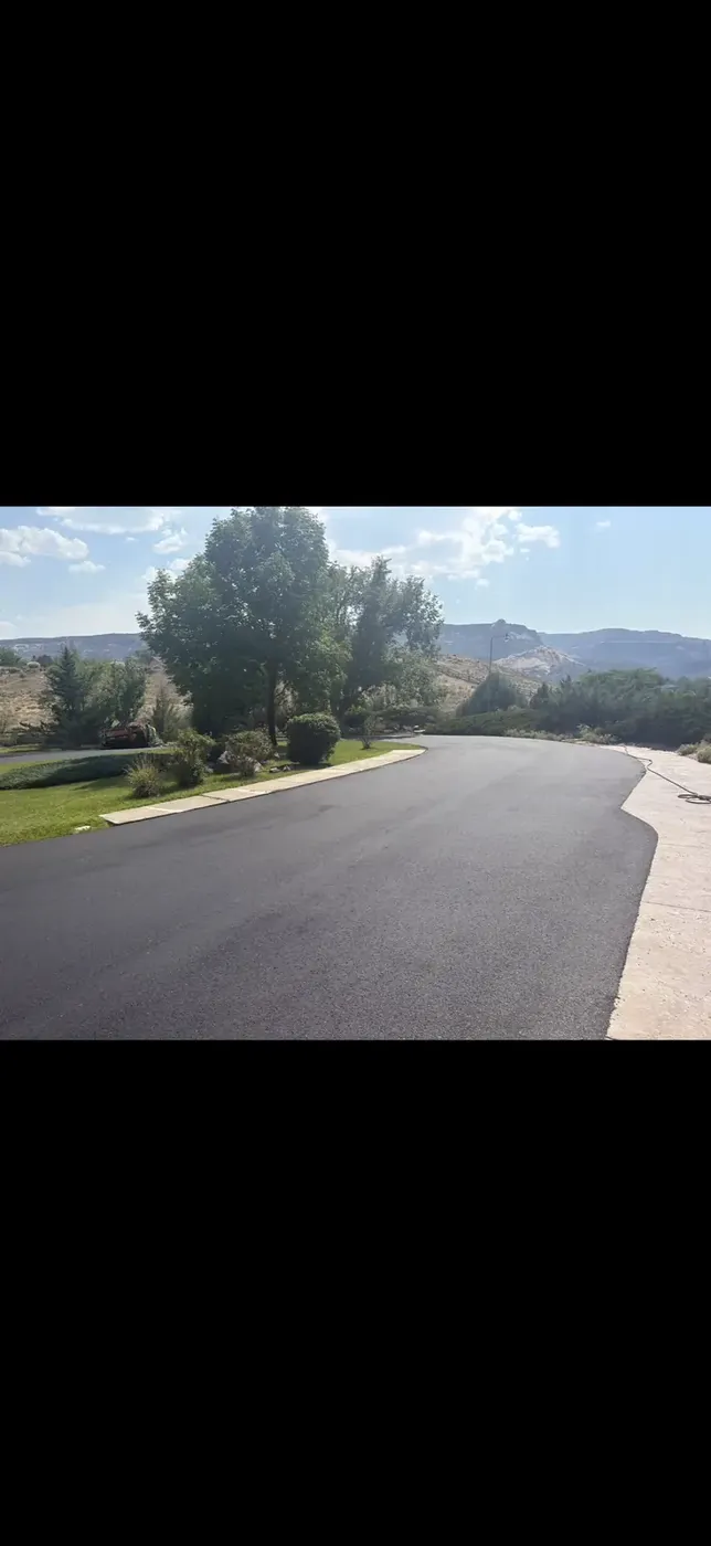 Wide new asphalt country road with mountain views