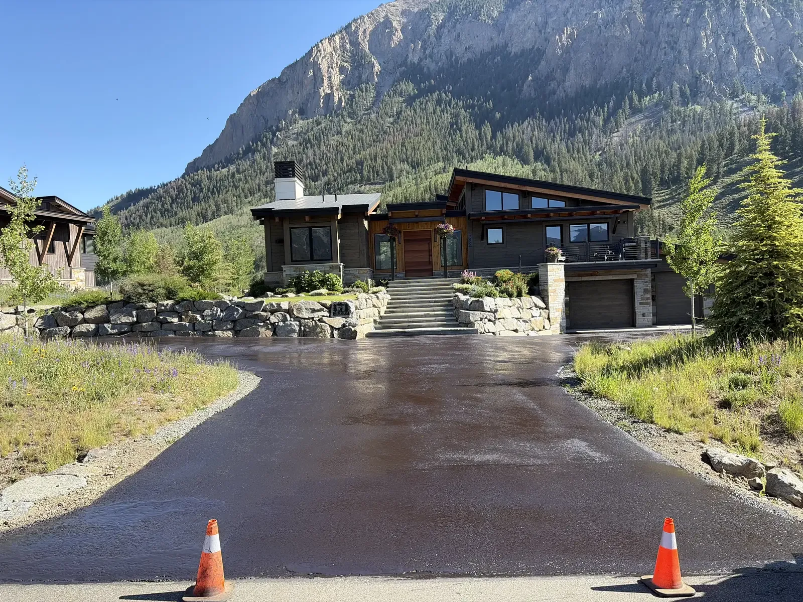 Freshly paved circular driveway at a modern mountain residence — near Kiowa, CO