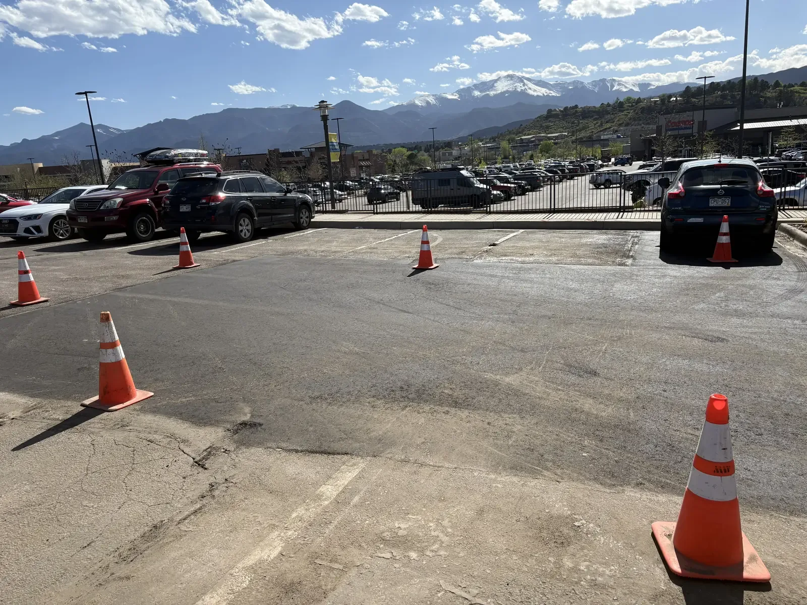 Phased parking lot work keeping a shopping center open — near Denver, CO