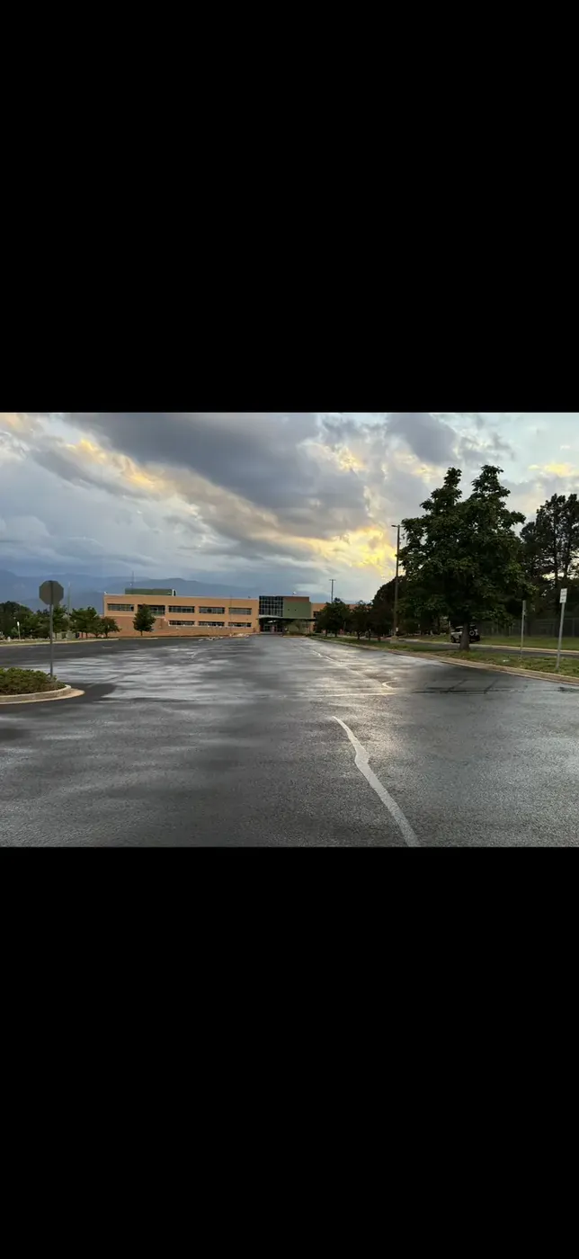 Newly overlaid office building parking lot at sunset