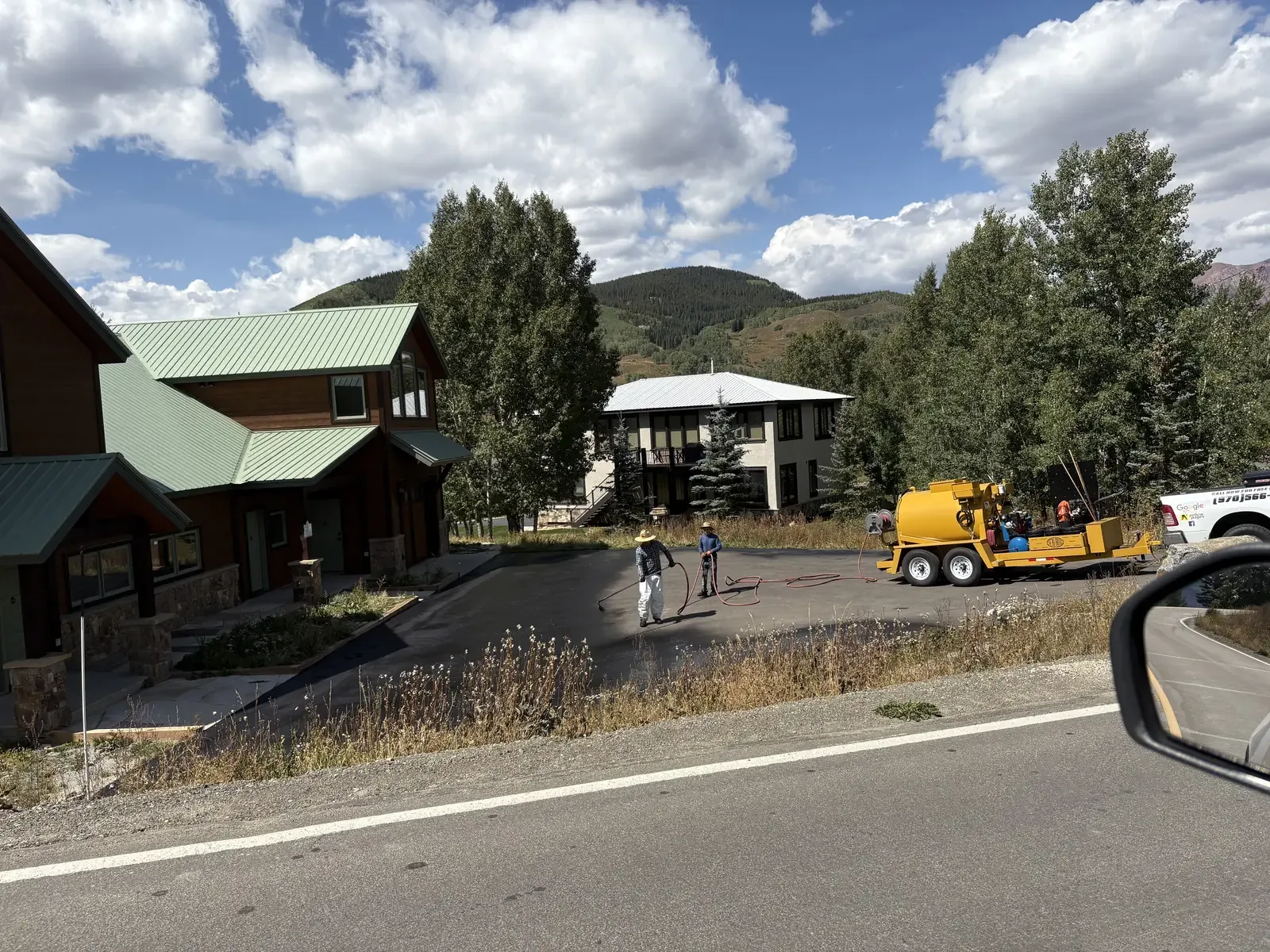 Crew and equipment staged at a residential paving job — near Calhan, CO