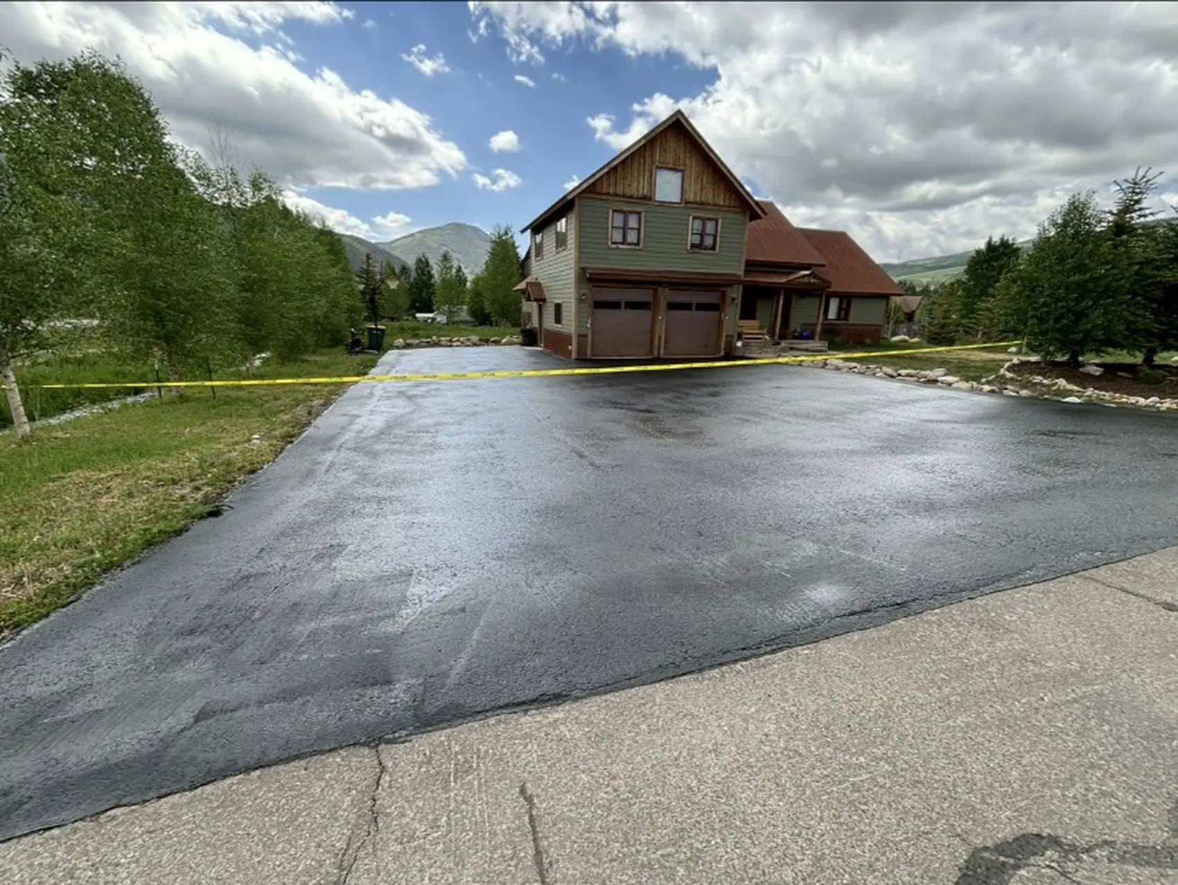 New residential asphalt driveway with clean edges